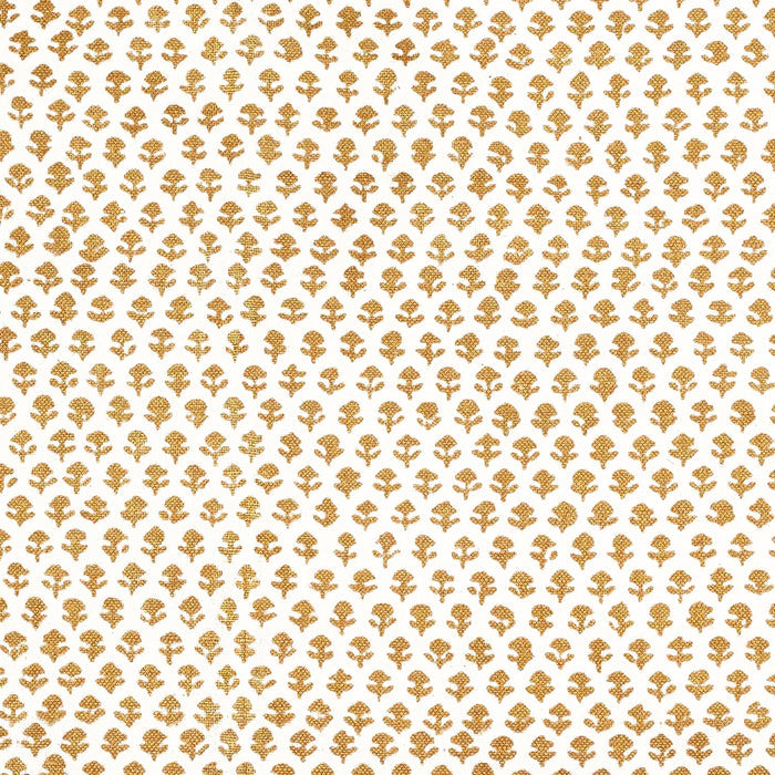 A Bindi Gold Fabric with a gold and white pattern on traditional hand block printed fabrics by John Robshaw.
