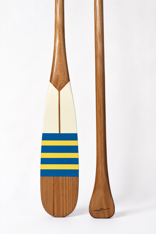 Bahr Paddle 02 featuring a sleek design with a wooden handle and vibrant blue blade for water sports or paddleboarding activities.